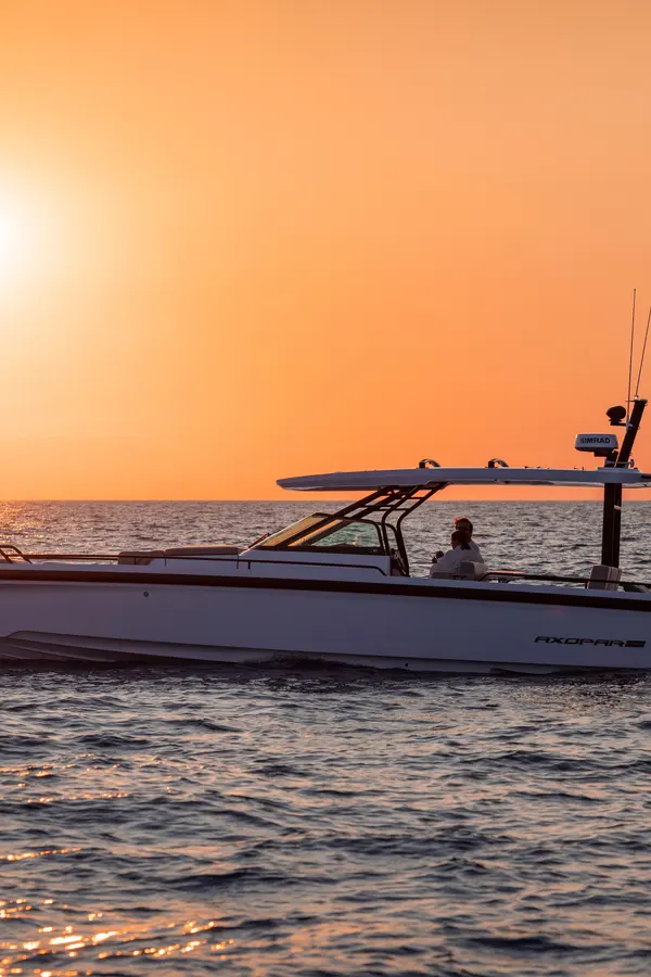 Modern Axopar 37 speedboats navigating the deep blue waters along the beautiful Cretan coastline.